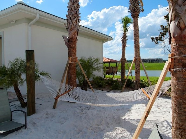 view of home's exterior featuring volleyball court