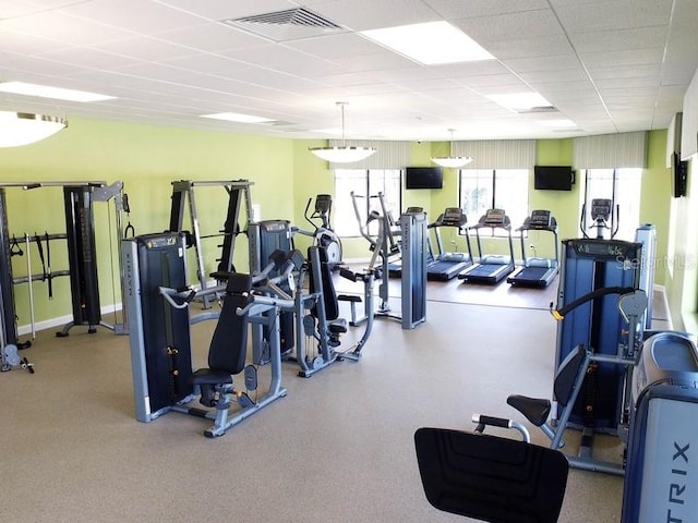 gym featuring a drop ceiling