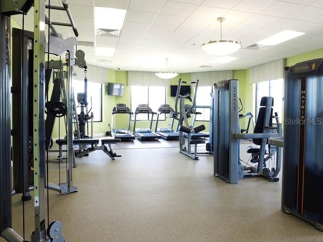 workout area with a paneled ceiling