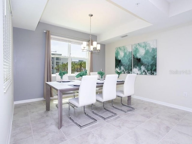 dining room featuring a notable chandelier and light tile patterned floors