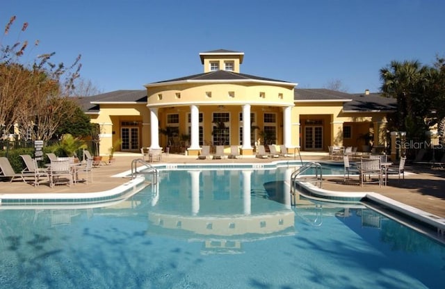 view of swimming pool with a patio area