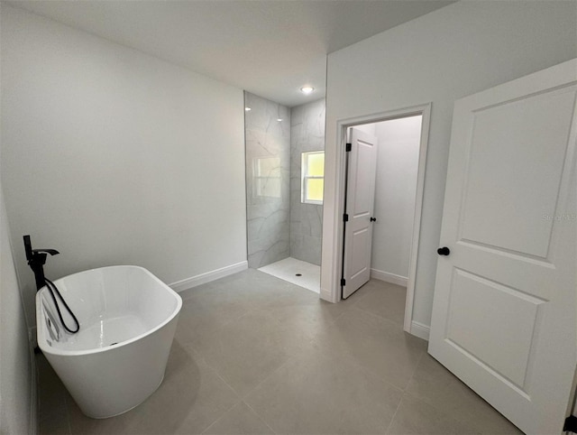 bathroom featuring shower with separate bathtub and tile flooring