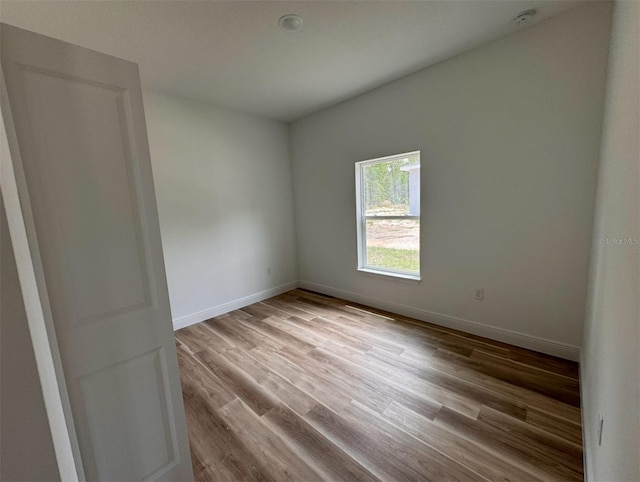 spare room featuring hardwood / wood-style floors