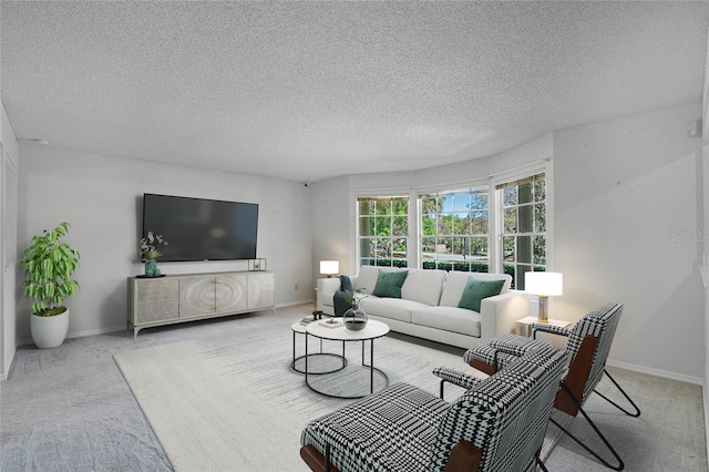 carpeted living room featuring a textured ceiling