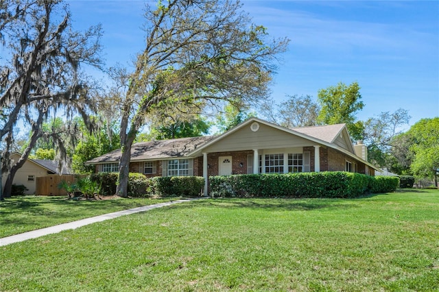 ranch-style home with a front yard