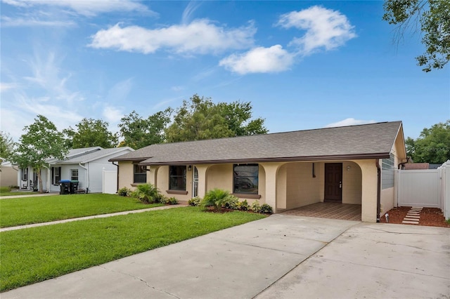 ranch-style house with a front yard