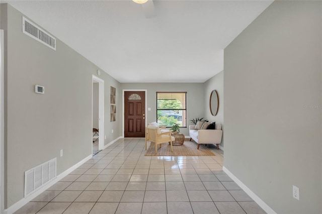 tiled foyer entrance featuring ceiling fan