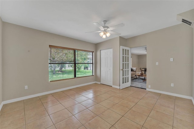 unfurnished room featuring light tile patterned floors, french doors, and ceiling fan