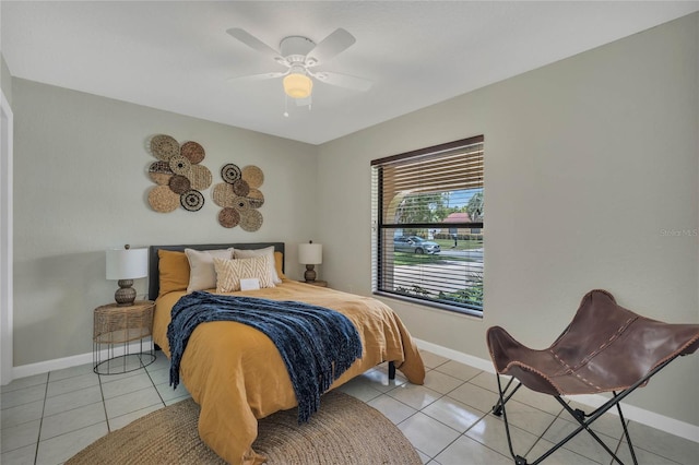 tiled bedroom with ceiling fan