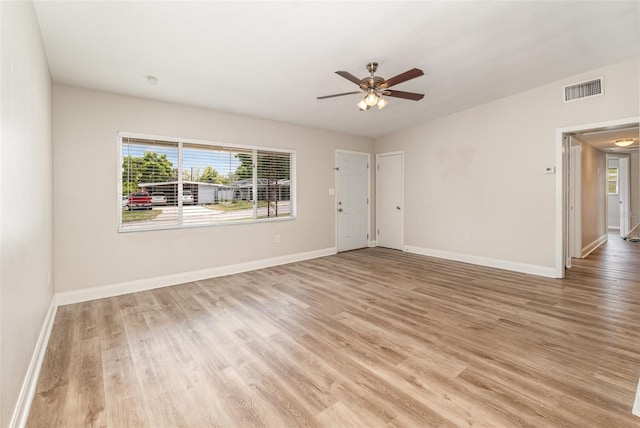 unfurnished room featuring ceiling fan and light hardwood / wood-style flooring