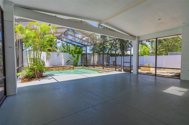 unfurnished sunroom with vaulted ceiling