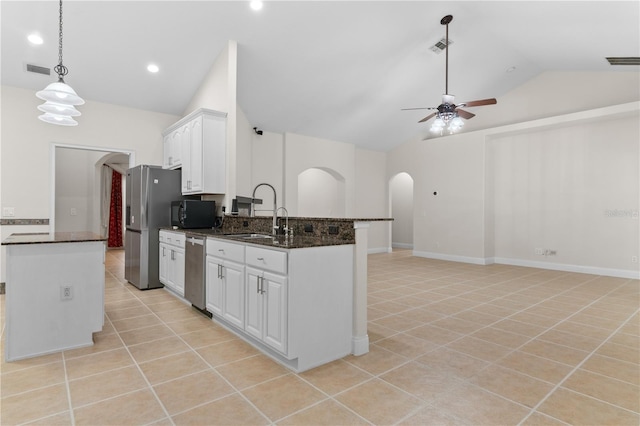 kitchen with light tile patterned flooring, white cabinetry, sink, hanging light fixtures, and stainless steel appliances