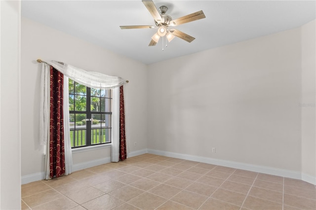 tiled empty room with ceiling fan