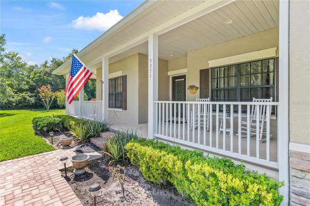 doorway to property with a porch