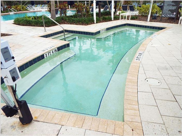 view of pool with a patio