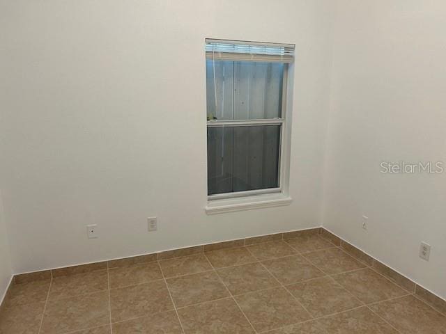 view of tiled spare room