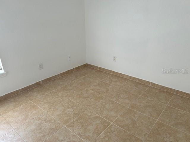 view of tiled spare room