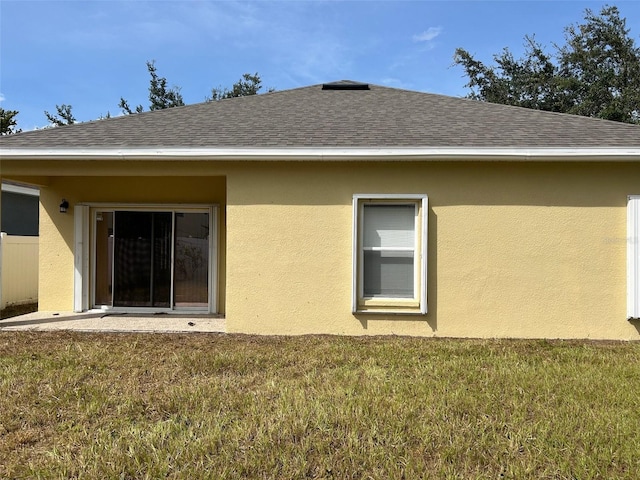 back of house with a yard