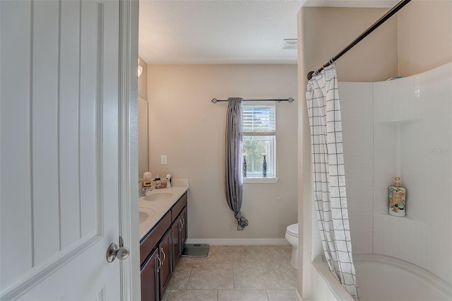 full bathroom with shower / tub combo with curtain, a textured ceiling, tile flooring, toilet, and dual bowl vanity