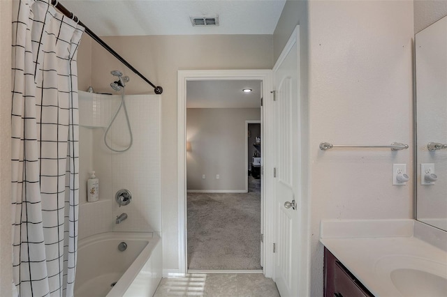 bathroom with shower / bath combo, a textured ceiling, and vanity