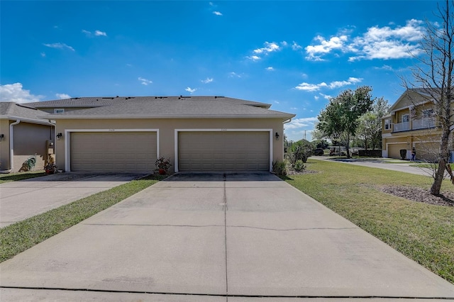 exterior space featuring a lawn and a garage