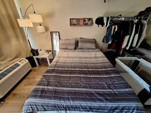 bedroom with light hardwood / wood-style flooring