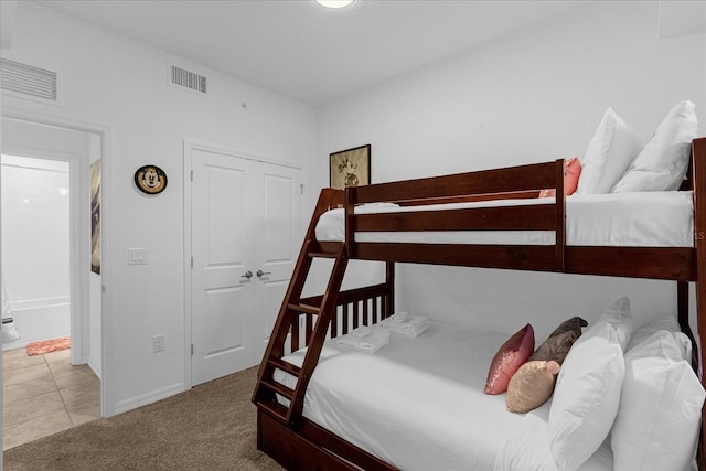 bedroom with light colored carpet