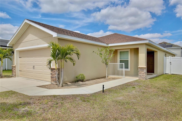 view of front of property with solar panels, a front lawn, and a garage