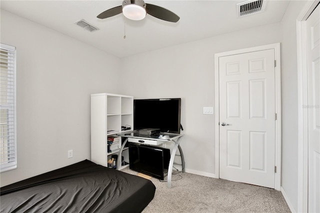 carpeted bedroom with ceiling fan