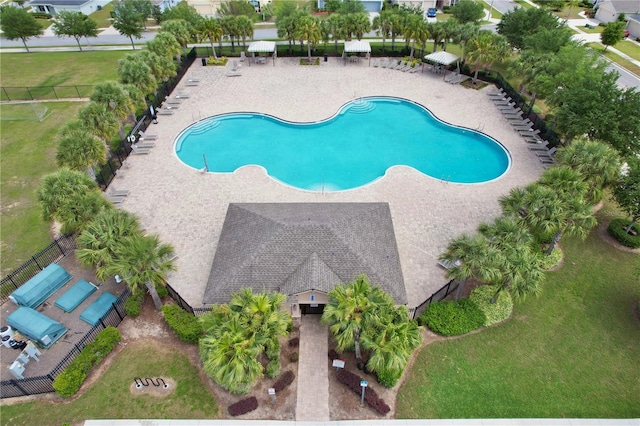 view of swimming pool with a yard and a patio area