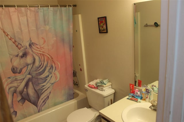 full bathroom featuring toilet, shower / bath combo with shower curtain, and vanity