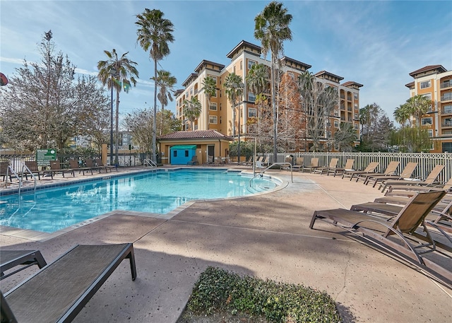 view of pool with an outdoor structure and a patio