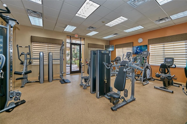 exercise room with a drop ceiling