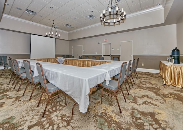 dining space with a high ceiling, crown molding, and an inviting chandelier