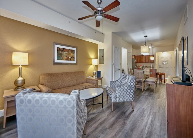 living room featuring dark hardwood / wood-style floors and ceiling fan