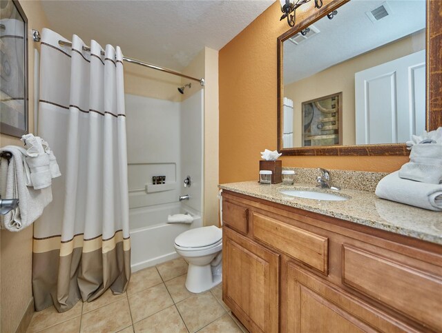 full bathroom with tile flooring, a textured ceiling, toilet, shower / bath combination with curtain, and oversized vanity