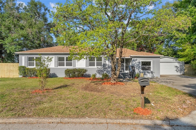 ranch-style home with a front lawn and a garage