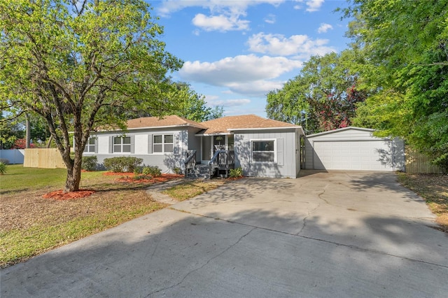 single story home featuring a front lawn and a garage