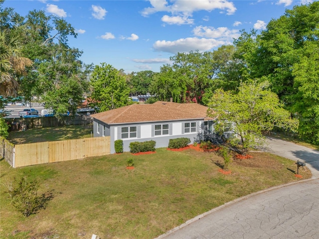 single story home with a front yard