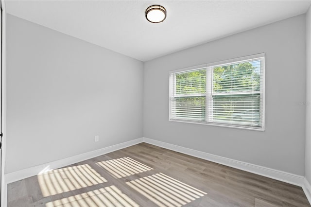 unfurnished room featuring light hardwood / wood-style flooring