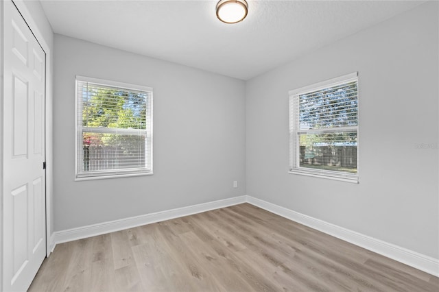 spare room featuring light hardwood / wood-style flooring