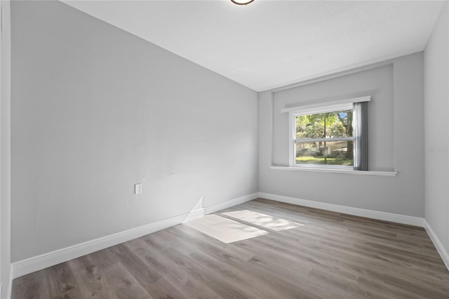 empty room featuring dark wood-type flooring