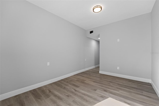 spare room with light wood-type flooring