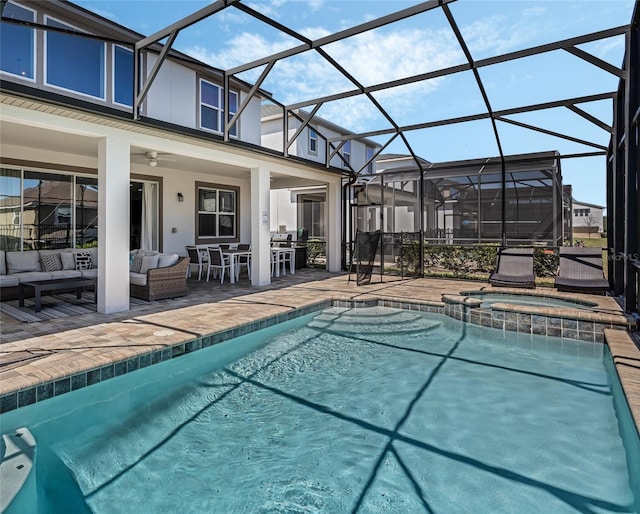 view of swimming pool featuring ceiling fan, an in ground hot tub, glass enclosure, an outdoor living space, and a patio