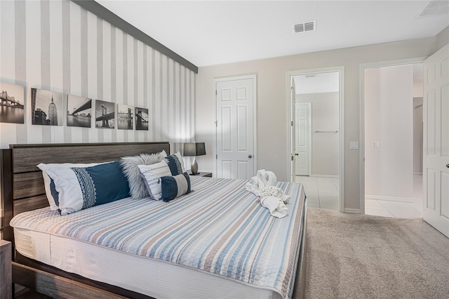 bedroom featuring light colored carpet