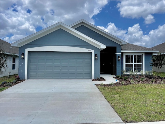 view of front of house with a front yard and a garage