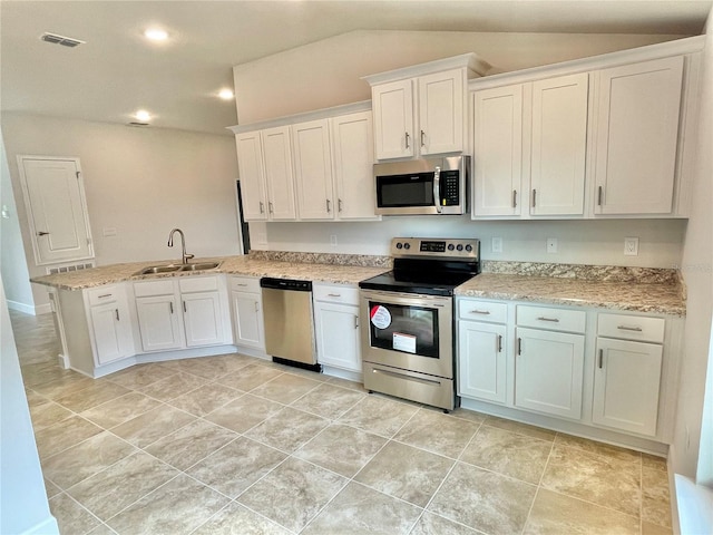 kitchen with kitchen peninsula, sink, white cabinets, stainless steel appliances, and light tile flooring