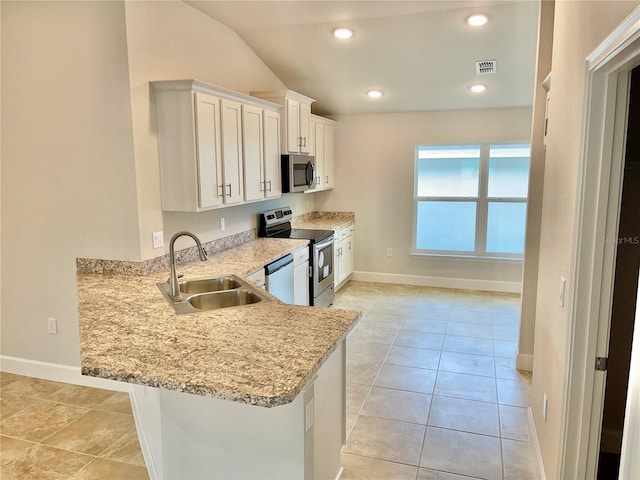 kitchen featuring white cabinets, light tile flooring, sink, and stainless steel appliances