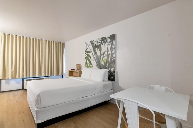 bedroom with light wood-type flooring