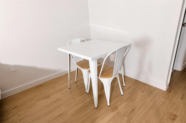 dining space featuring light hardwood / wood-style flooring